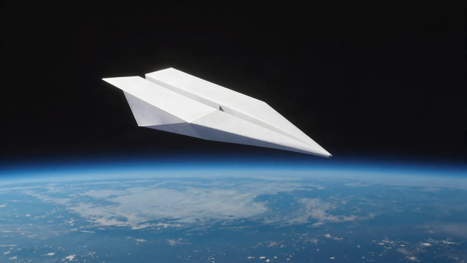 Paper airplane in orbit above Earth